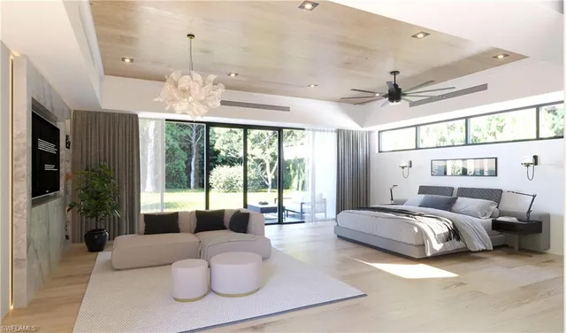 a spacious bedroom with a bed and a large window