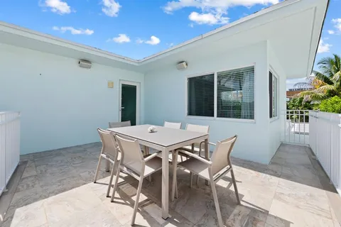 a dining room with a table and chairs