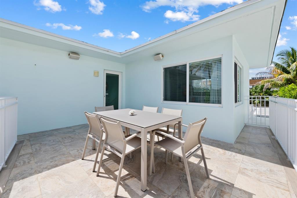 3321 Northeast 16th Court Fort Lauderdale, FL 33305 - Photo 19 of 41 a dining room with a table and chairs