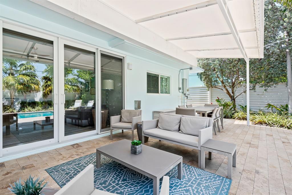 3321 Northeast 16th Court Fort Lauderdale, FL 33305 - Photo 29 of 41 a outdoor living space with furniture and garden view