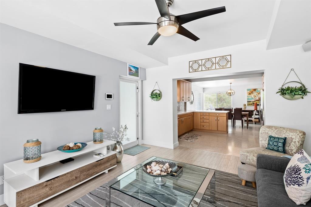 3321 Northeast 16th Court Fort Lauderdale, FL 33305 - Photo 36 of 41 a living room with furniture and a flat screen tv