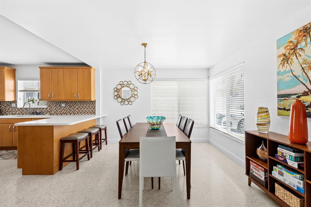 3321 Northeast 16th Court Fort Lauderdale, FL 33305 - Photo 38 of 41 a view of a dining room with furniture and a rug