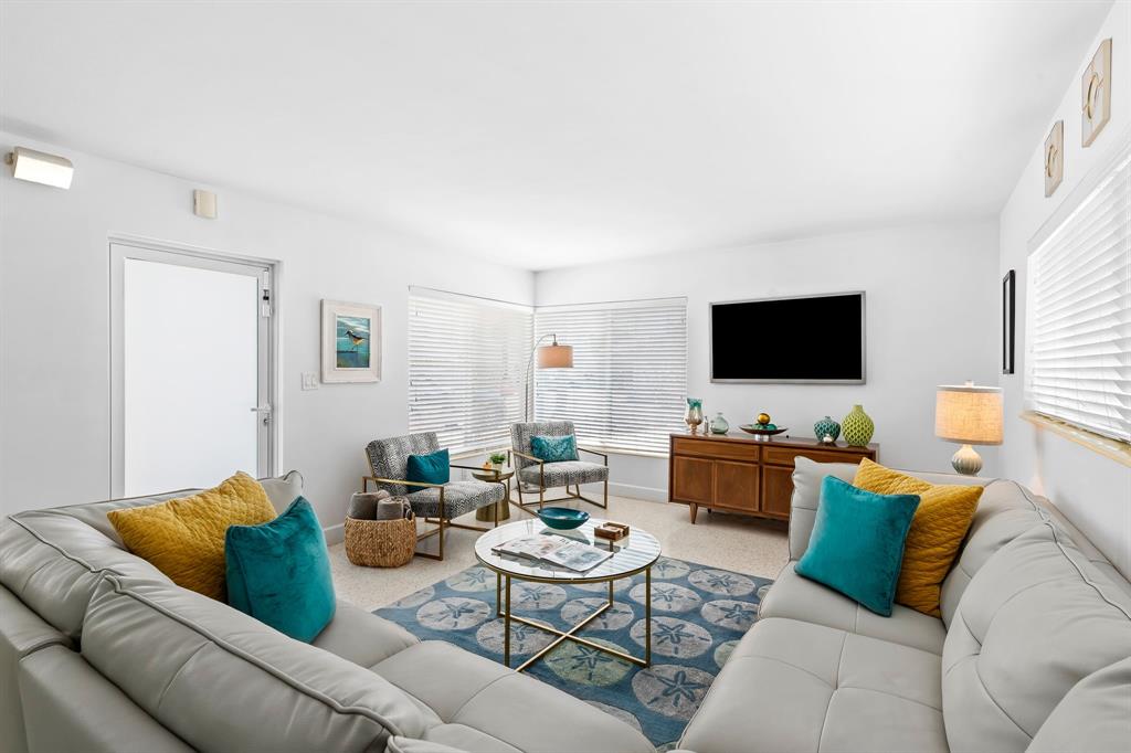 3321 Northeast 16th Court Fort Lauderdale, FL 33305 - Photo 7 of 41 a living room with furniture and a flat screen tv