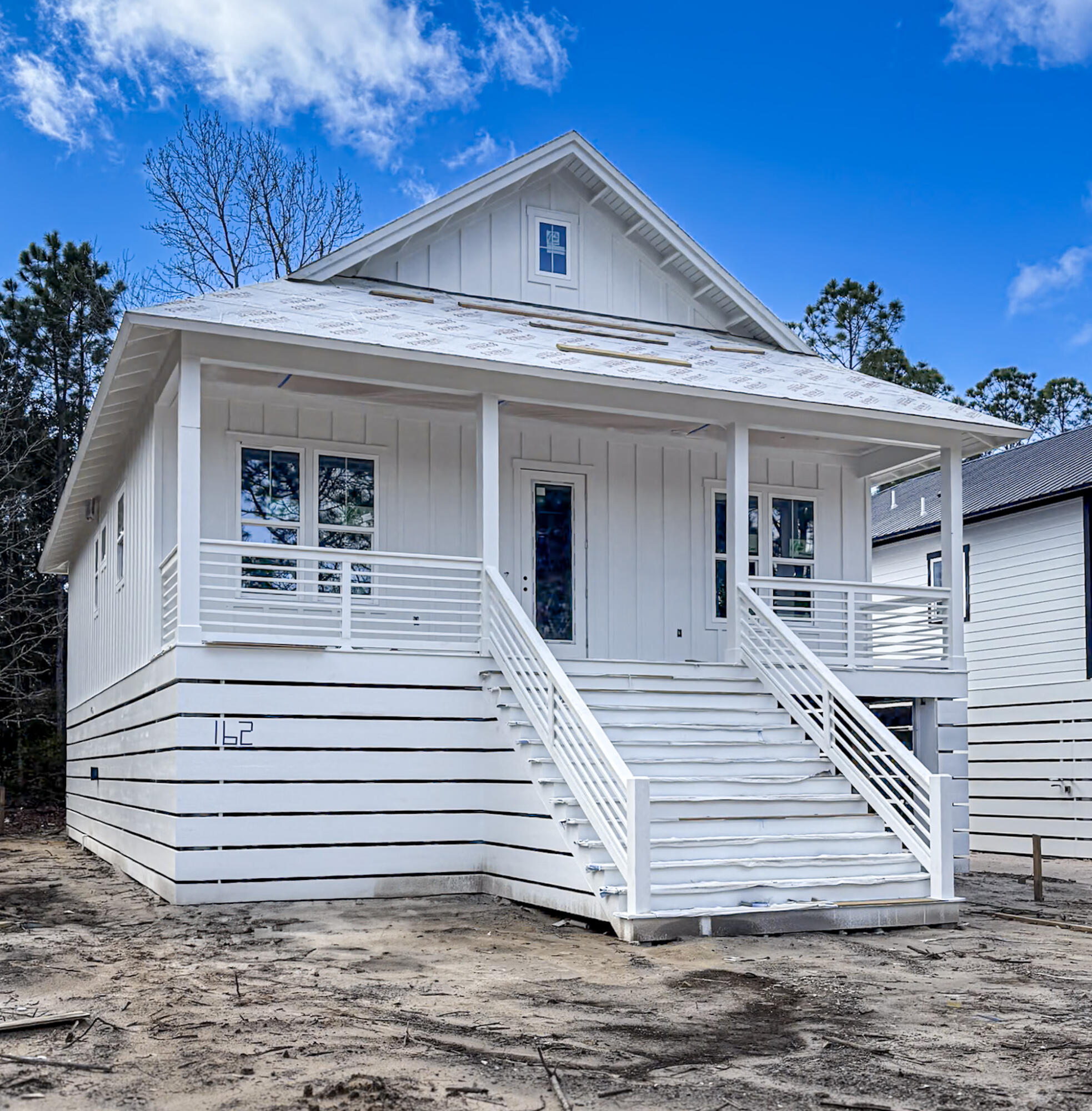 162 7th Street Santa Rosa Beach, FL 32459 - Photo 1 of 13 a view of a house with a yard