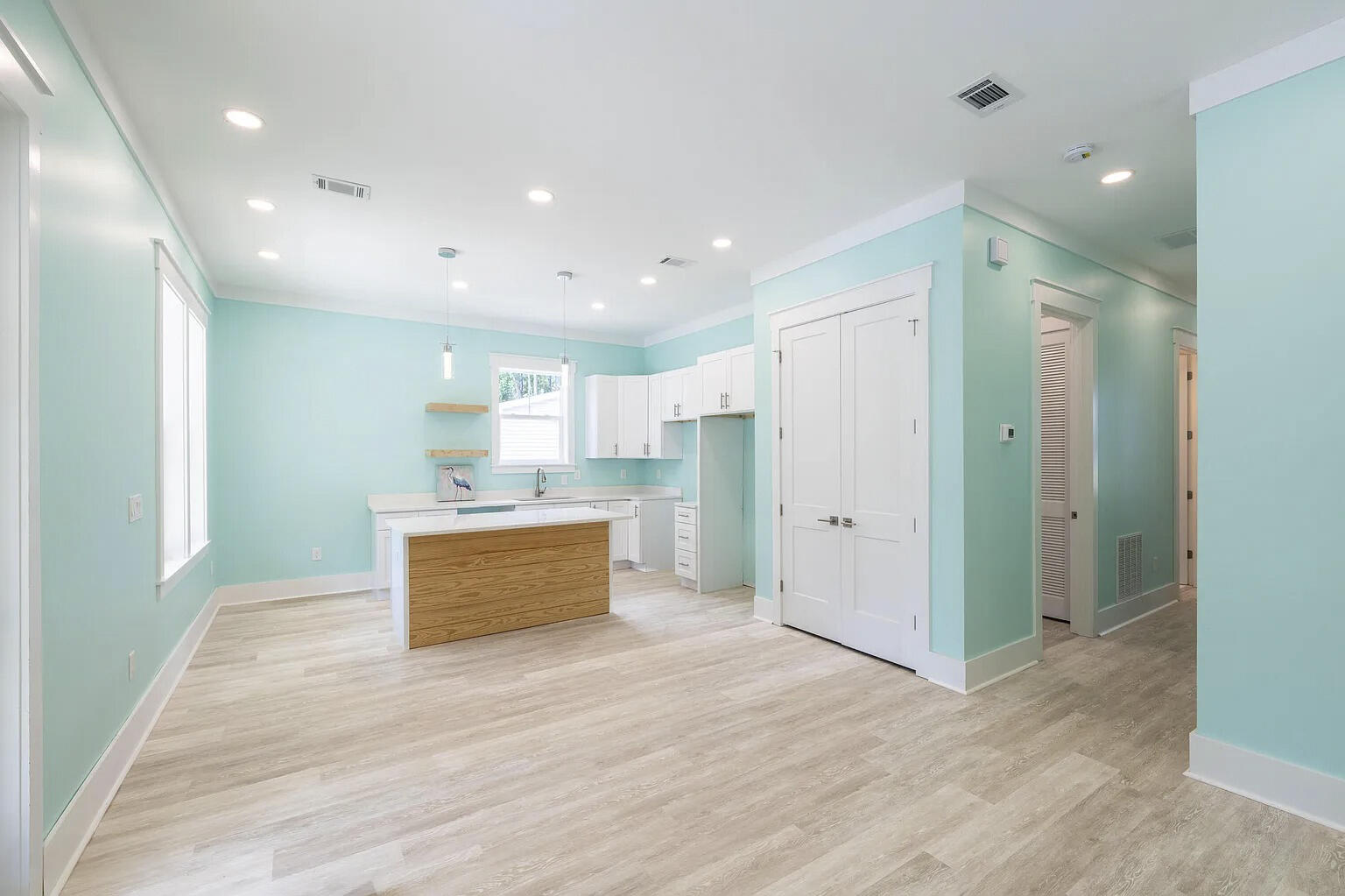 162 7th Street Santa Rosa Beach, FL 32459 - Photo 4 of 13 a room with stainless steel appliances kitchen island granite countertop a refrigerator and a sink