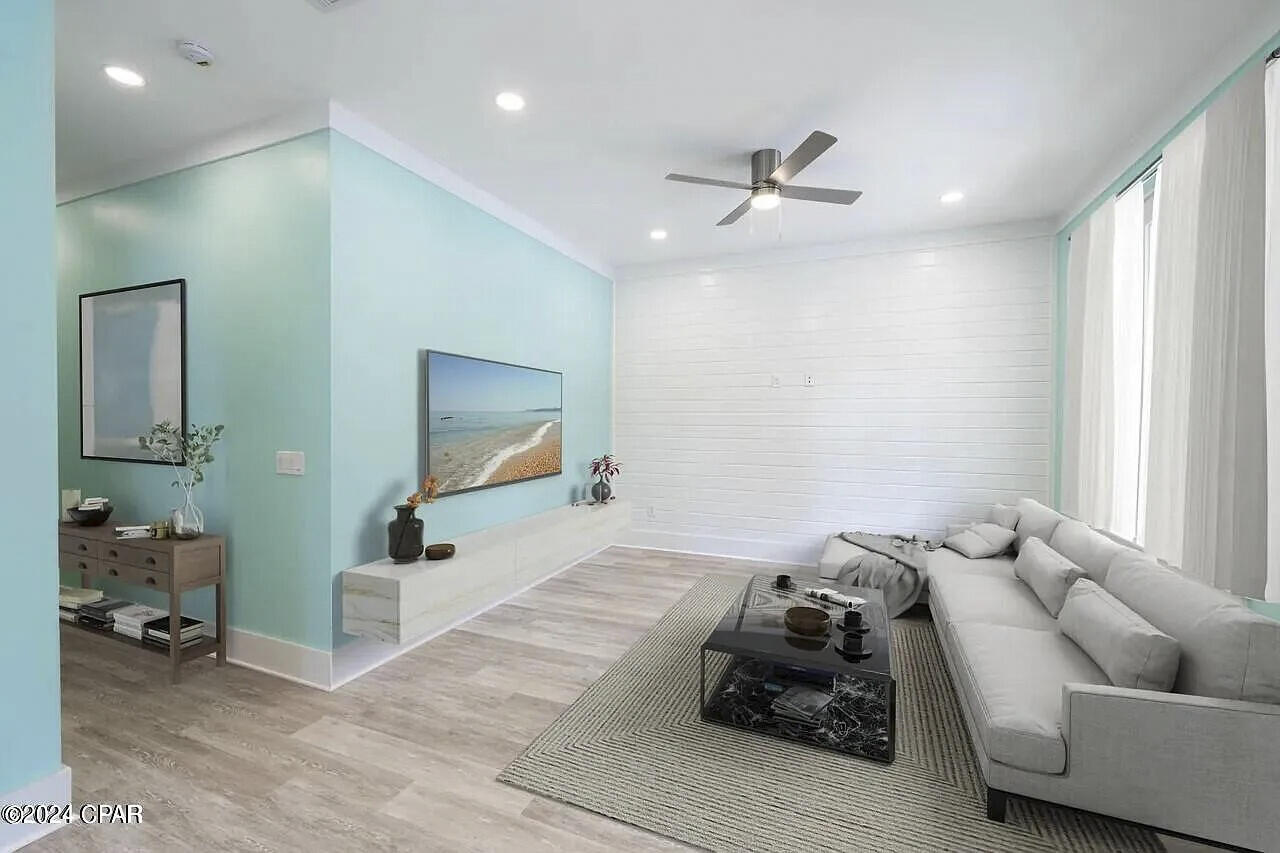 162 7th Street Santa Rosa Beach, FL 32459 - Photo 5 of 13 a living room with furniture and a flat screen tv