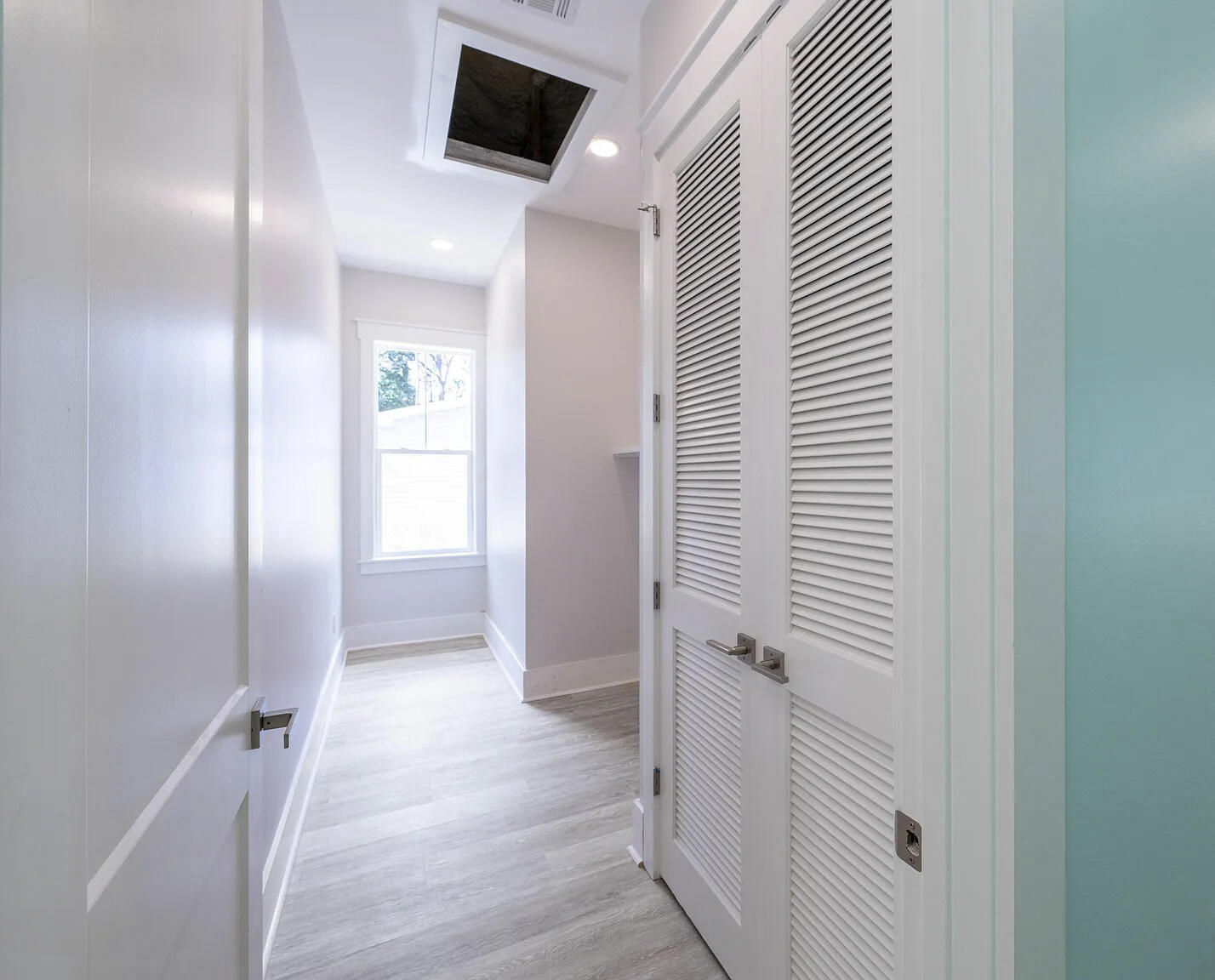 162 7th Street Santa Rosa Beach, FL 32459 - Photo 6 of 13 a view of a hallway with wooden floor