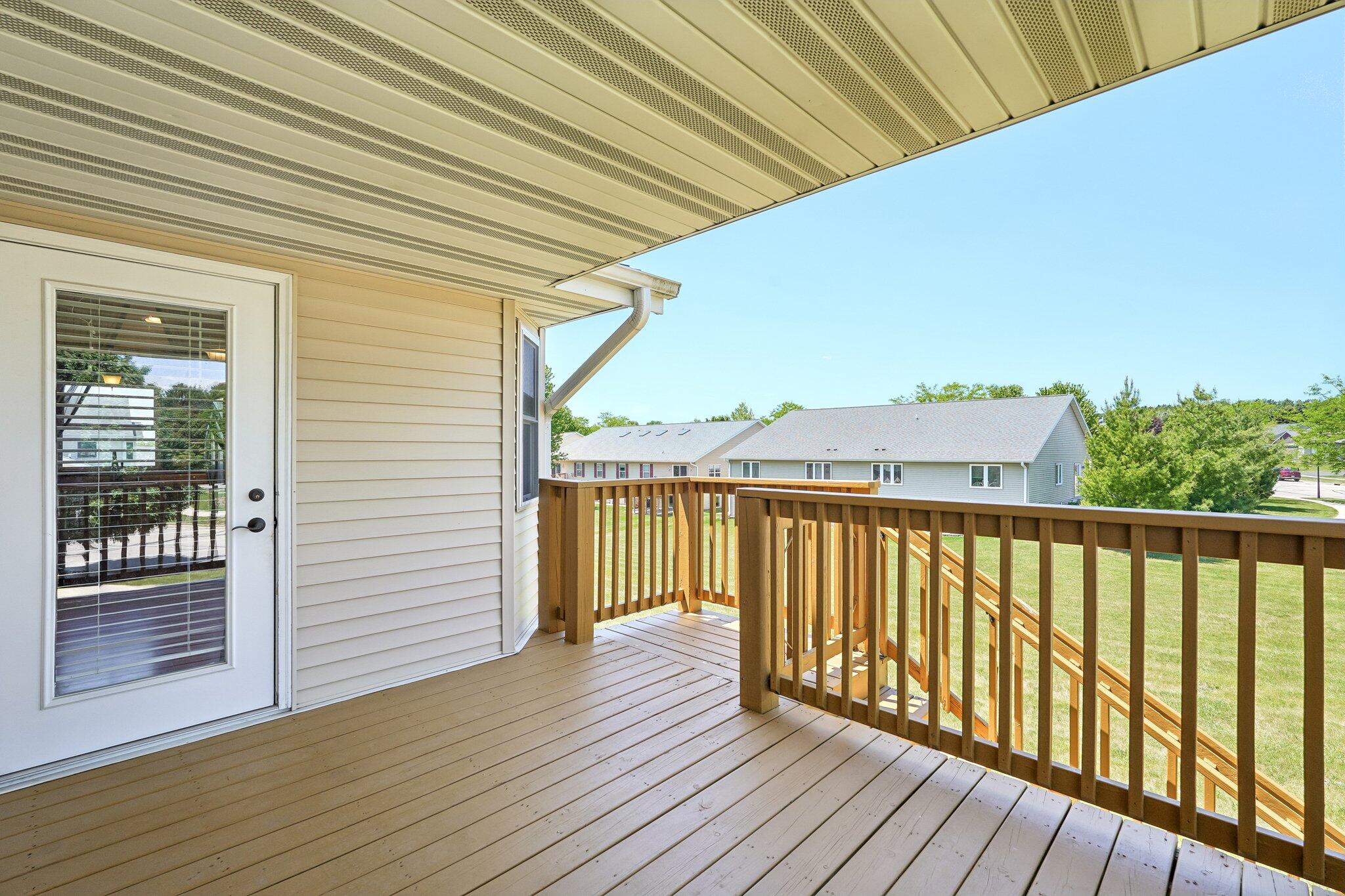 865 Prairie Gardens, Unit 91 Kewaskum, WI 53040 - Photo 33 of 39 Covered Deck with Stairs