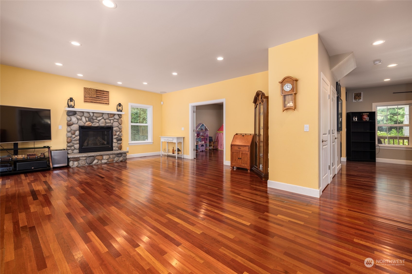 835 Alger Cain Lake Road Sedro-Woolley, WA 98284 - Photo 12 of 38 a view of a living room with furniture fireplace and wooden floor