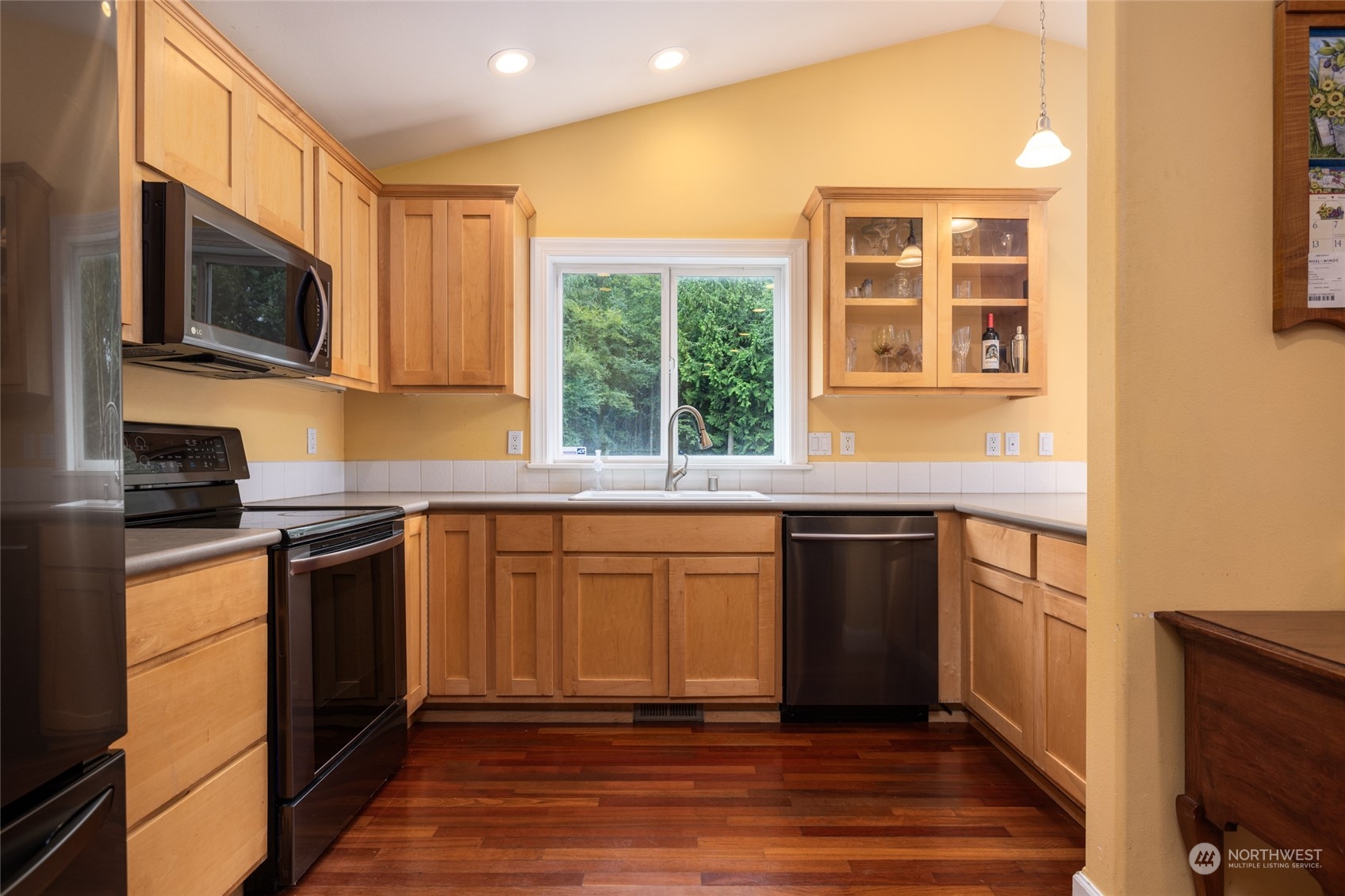 835 Alger Cain Lake Road Sedro-Woolley, WA 98284 - Photo 15 of 38 a kitchen with stainless steel appliances granite countertop a stove a sink and a microwave