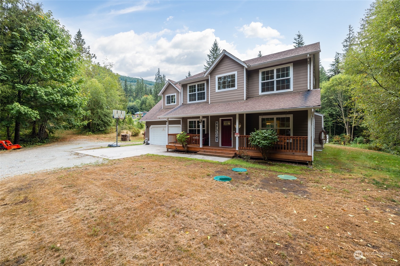 835 Alger Cain Lake Road Sedro-Woolley, WA 98284 - Photo 2 of 38 a view of a house with a yard and sitting area