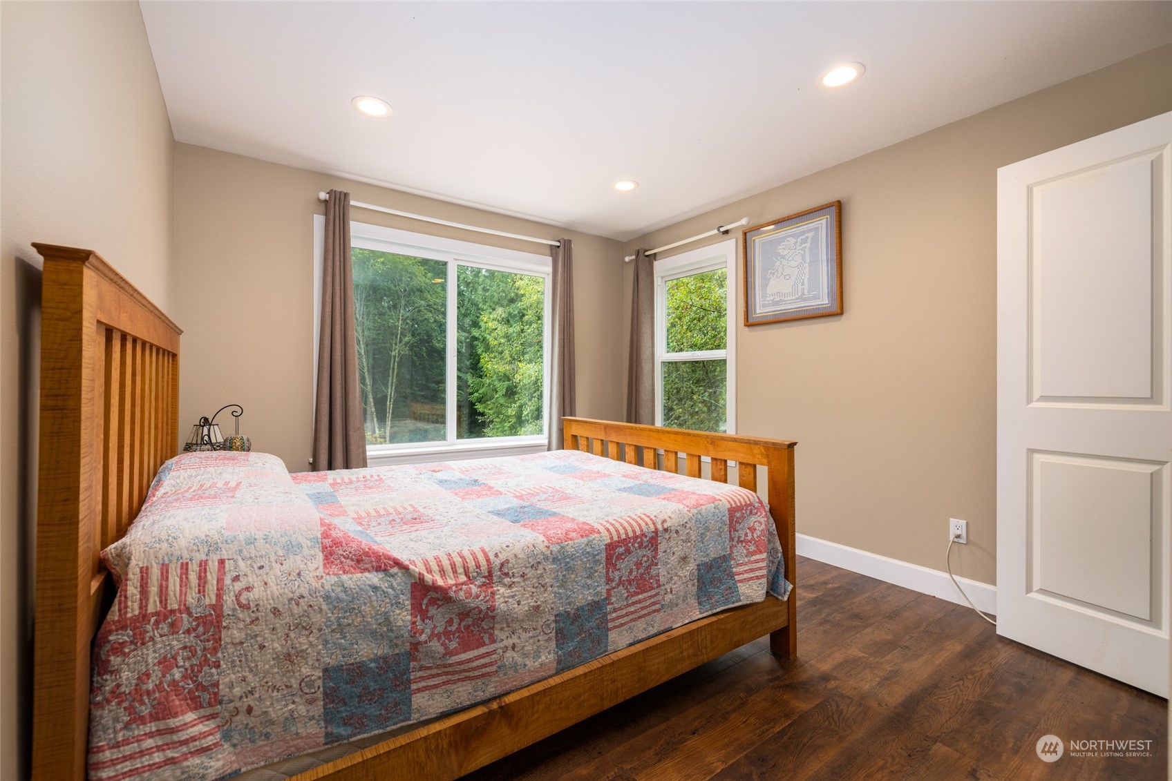835 Alger Cain Lake Road Sedro-Woolley, WA 98284 - Photo 28 of 38 a bed sitting in a spacious bedroom next to a window