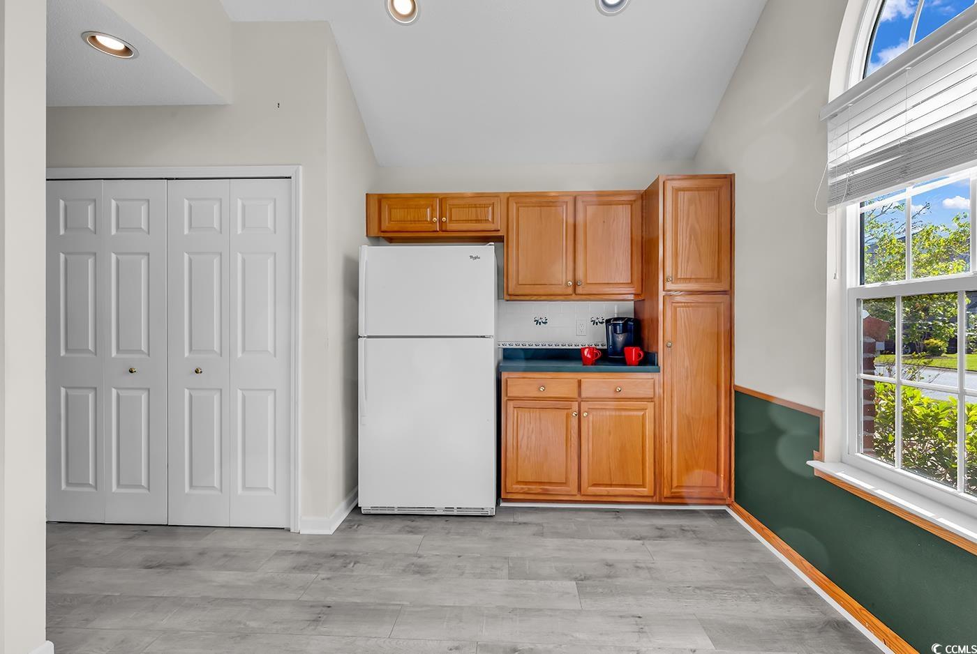 182 Wimbledon Way, Unit 182 Murrells Inlet, SC 29576 - Photo 11 of 37 Kitchen featuring baseboards, vaulted ceiling, lig