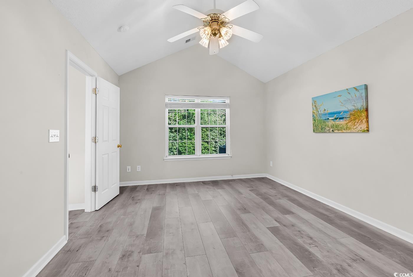 182 Wimbledon Way, Unit 182 Murrells Inlet, SC 29576 - Photo 14 of 37 Unfurnished room featuring ceiling fan, vaulted ce