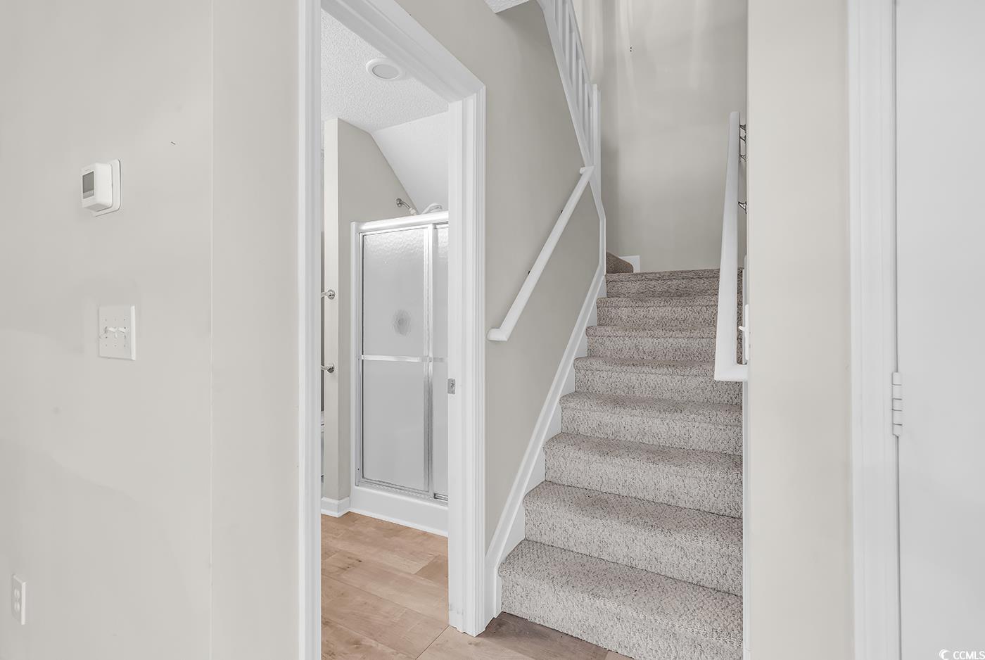 182 Wimbledon Way, Unit 182 Murrells Inlet, SC 29576 - Photo 18 of 37 Stairs featuring wood finished floors and baseboar