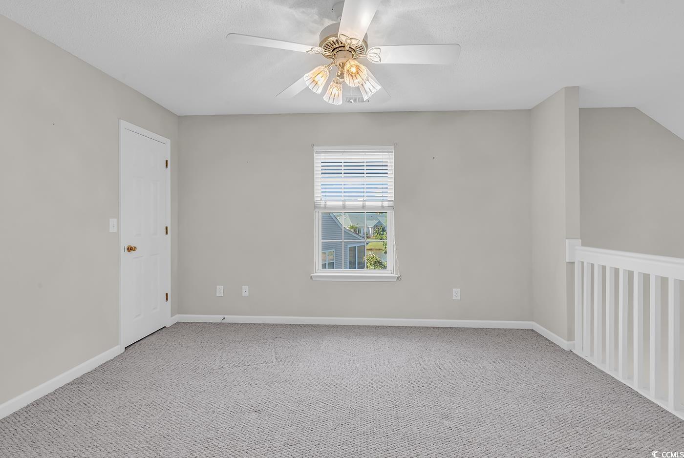 182 Wimbledon Way, Unit 182 Murrells Inlet, SC 29576 - Photo 21 of 37 Carpeted spare room with a textured ceiling, baseb