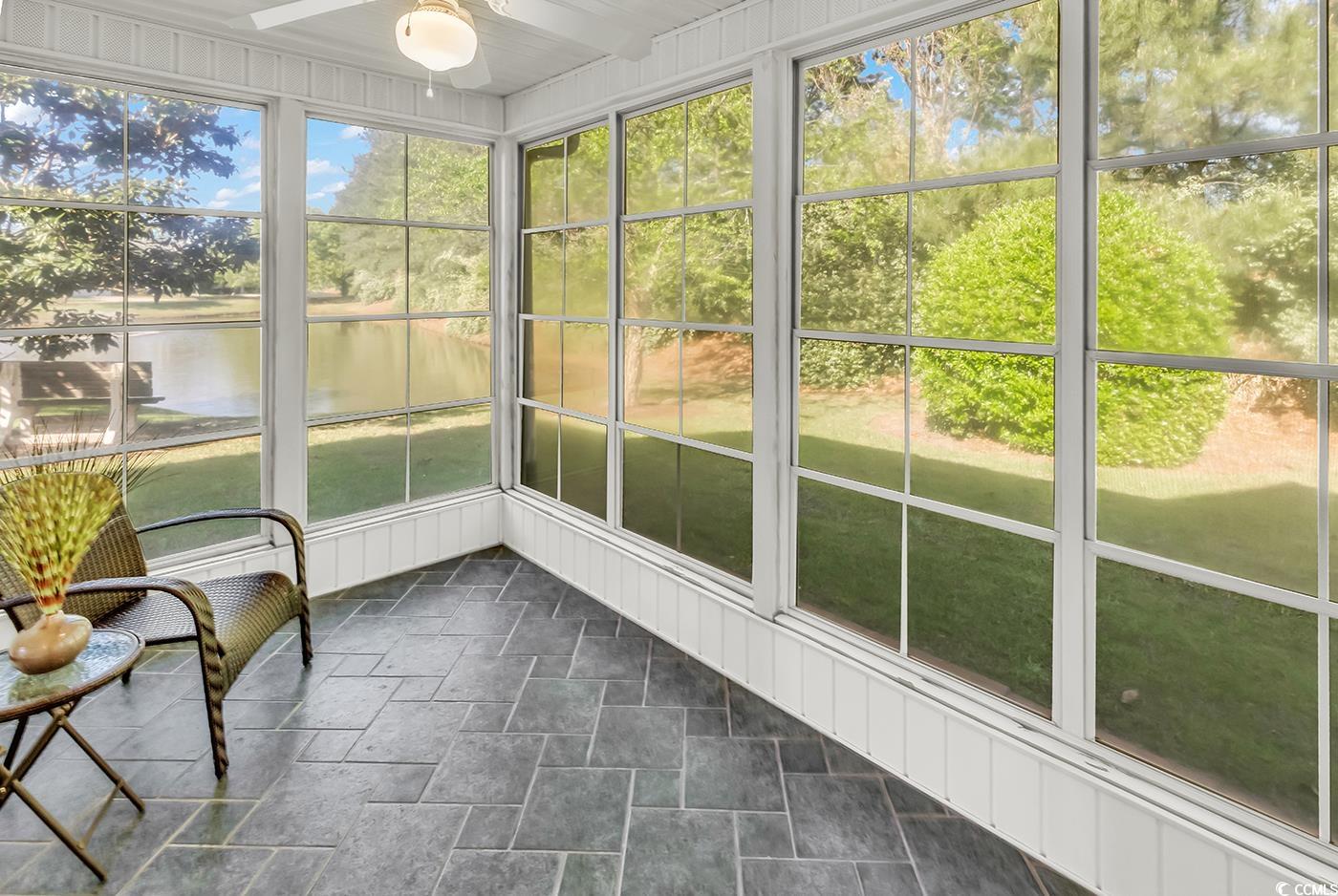 182 Wimbledon Way, Unit 182 Murrells Inlet, SC 29576 - Photo 22 of 37 Unfurnished sunroom with a water view and a ceilin