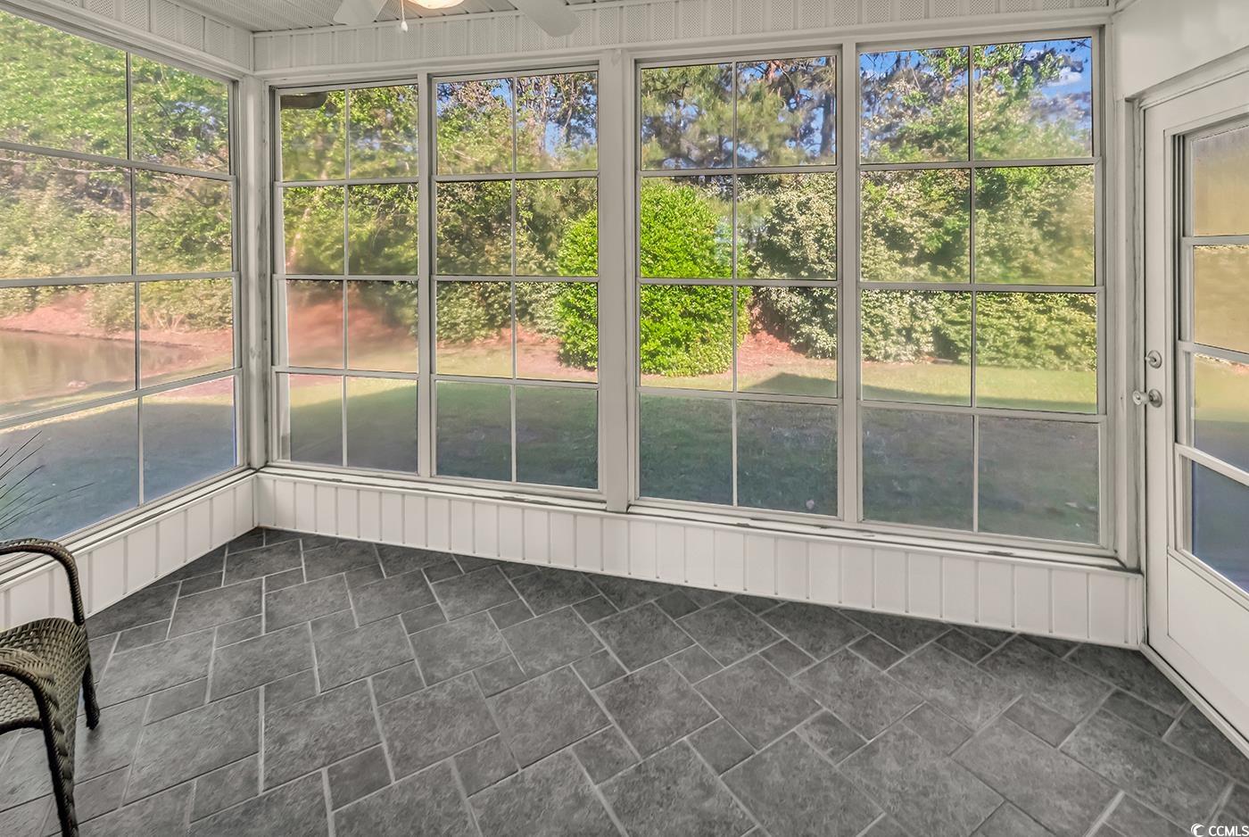 182 Wimbledon Way, Unit 182 Murrells Inlet, SC 29576 - Photo 23 of 37 Unfurnished sunroom with ceiling fan