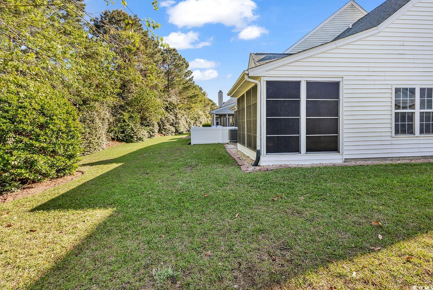 182 Wimbledon Way, Unit 182 Murrells Inlet, SC 29576 - Photo 24 of 37 View of yard featuring a sunroom