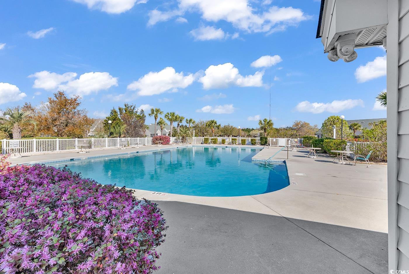 182 Wimbledon Way, Unit 182 Murrells Inlet, SC 29576 - Photo 29 of 37 Community pool featuring a patio and fence