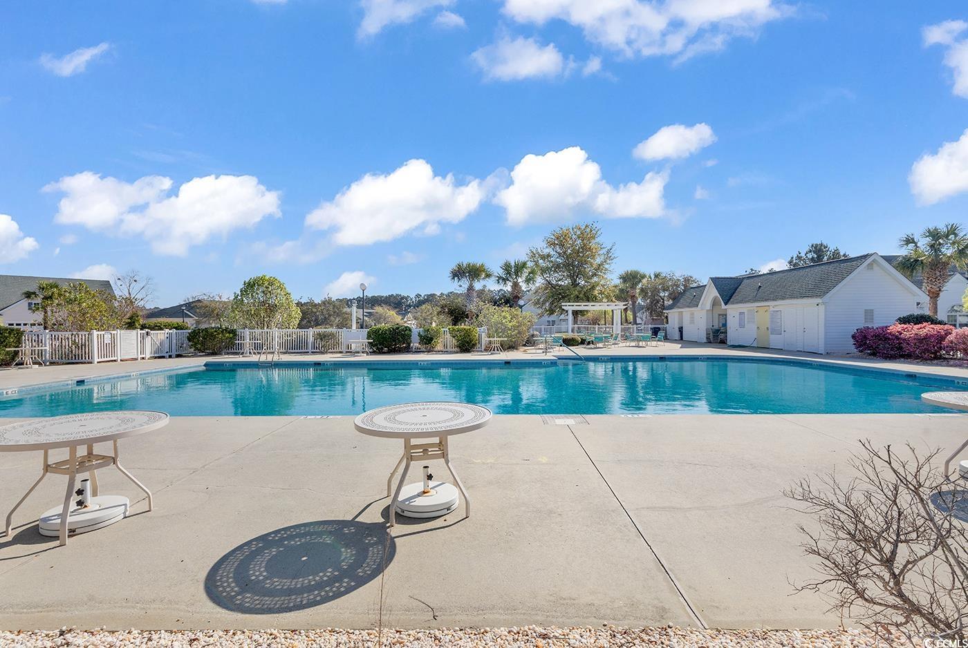 182 Wimbledon Way, Unit 182 Murrells Inlet, SC 29576 - Photo 30 of 37 Pool featuring a pergola, a patio, and fence