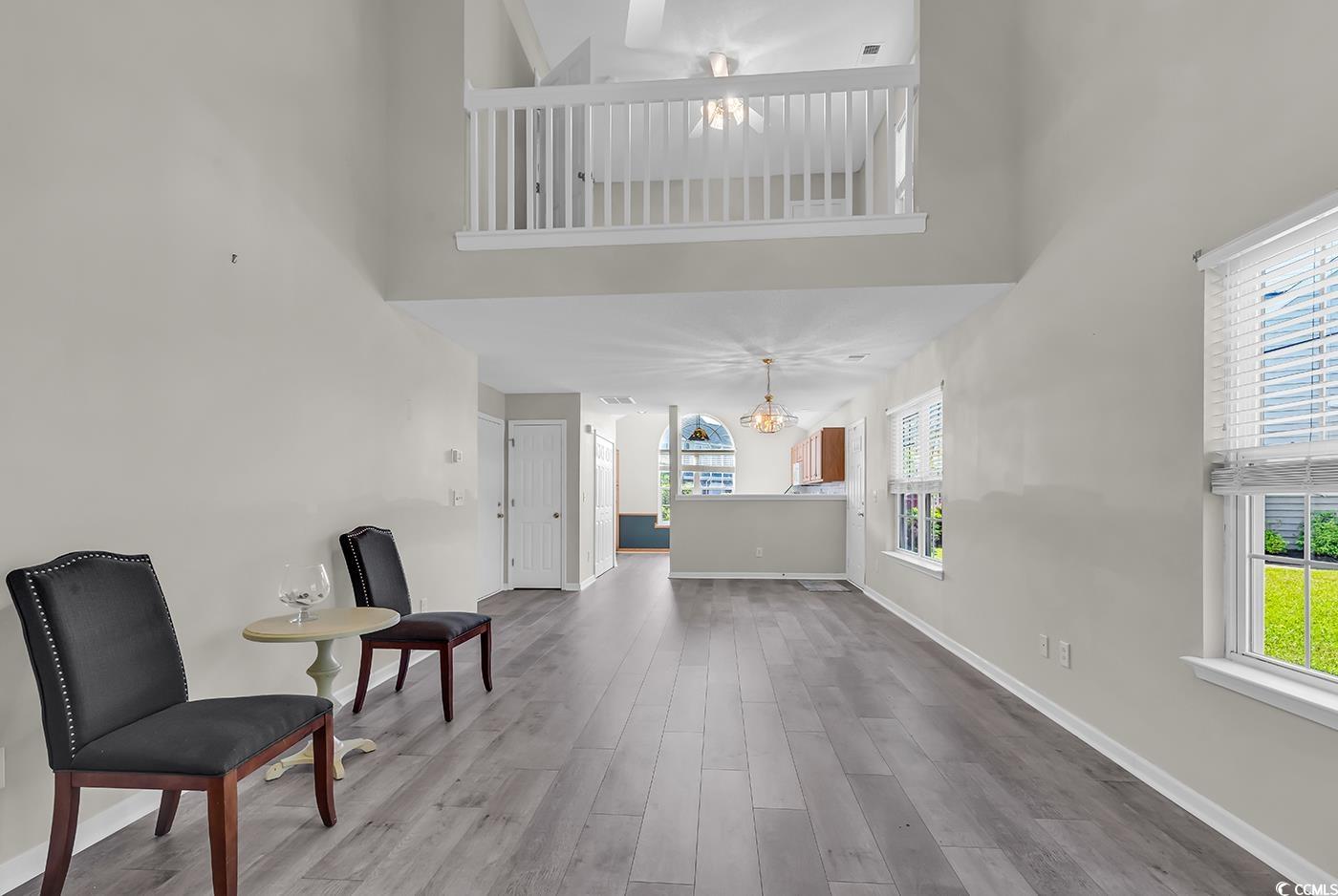 182 Wimbledon Way, Unit 182 Murrells Inlet, SC 29576 - Photo 7 of 37 Sitting room with wood finished floors, a high cei