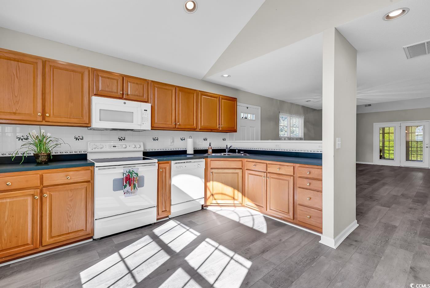 182 Wimbledon Way, Unit 182 Murrells Inlet, SC 29576 - Photo 10 of 37 Kitchen featuring wood finished floors, visible ve