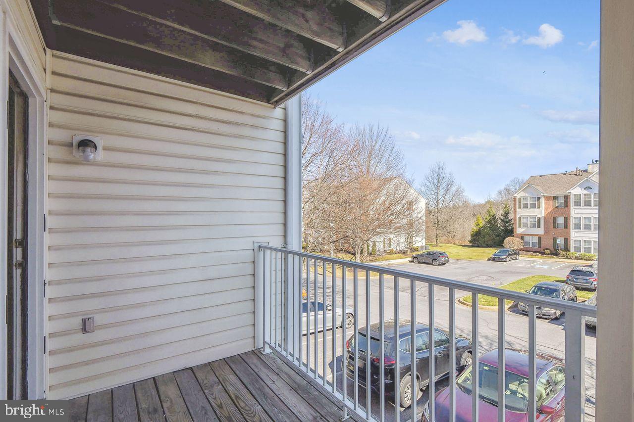 9727 Reese Farm Road, Unit 9727 Owings Mills, MD 21117 - Photo 4 of 32 a view of a balcony with furniture