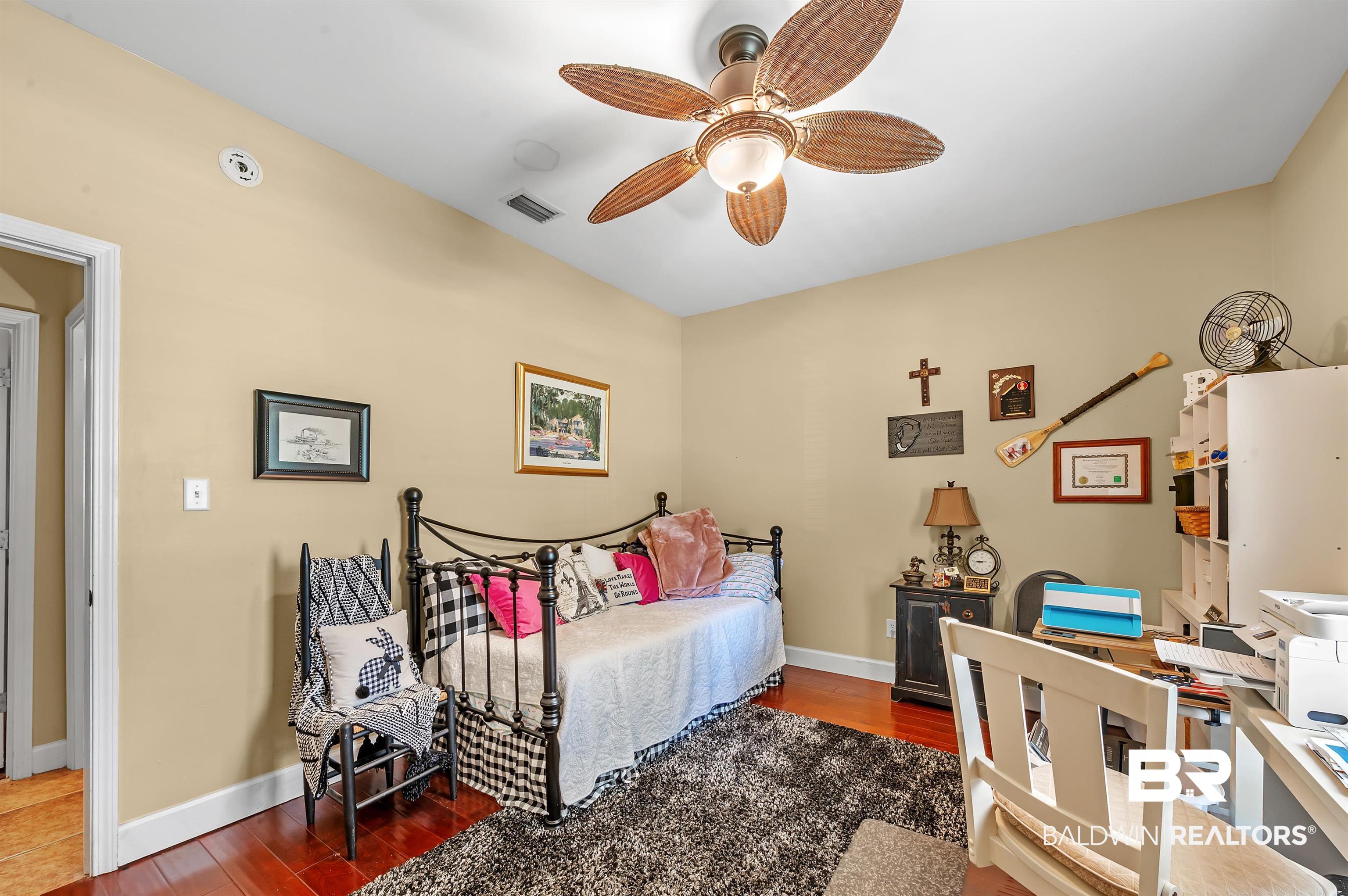 9901 Glover Court Fairhope, AL 36532 - Photo 30 of 52 Bedroom with ceiling fan and dark hardwood / wood-style flooring