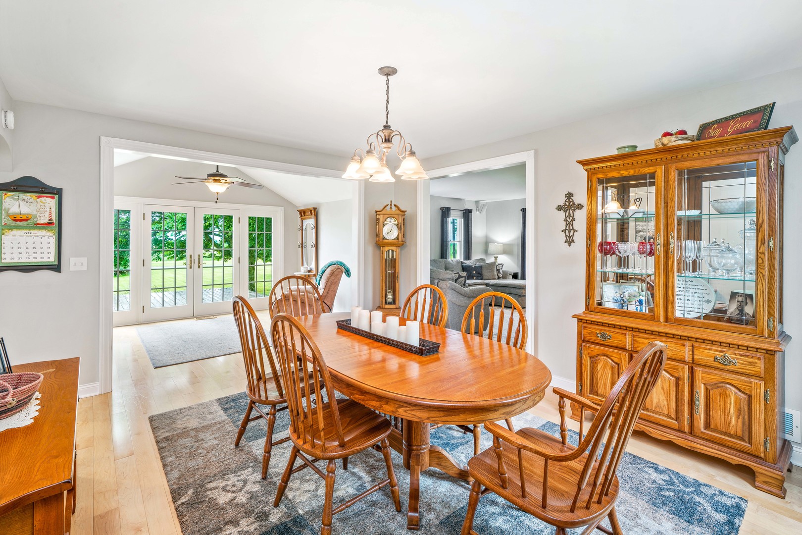 10732 Rimsnider Road Hinckley, IL 60520 - Photo 19 of 44 a dining room with furniture a chandelier and wooden floor
