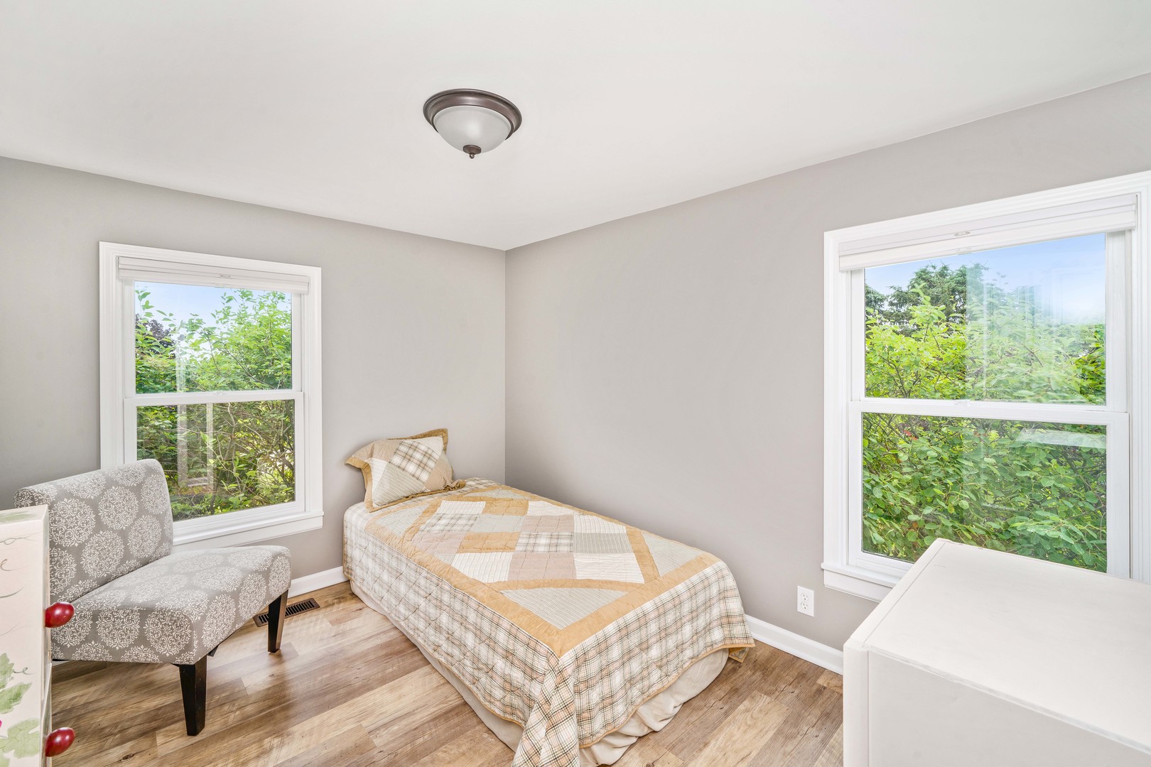 10732 Rimsnider Road Hinckley, IL 60520 - Photo 24 of 44 a bedroom with a bed and wooden floor