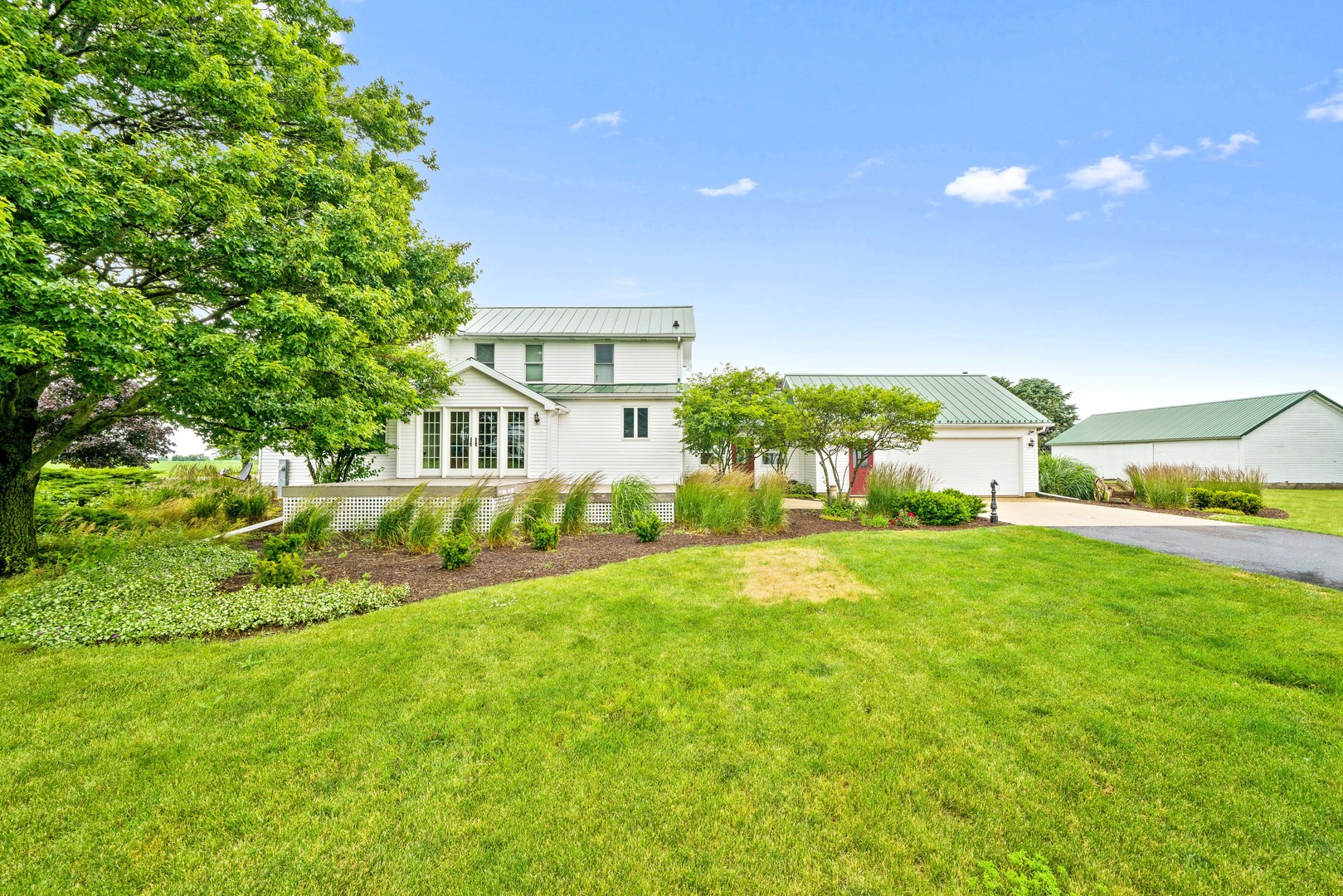 10732 Rimsnider Road Hinckley, IL 60520 - Photo 9 of 44 a house view with a garden space