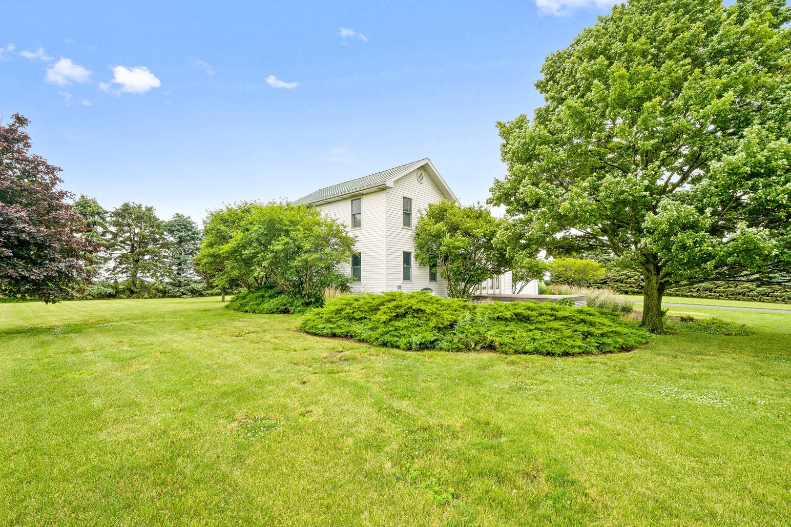 10732 Rimsnider Road Hinckley, IL 60520 - Photo 10 of 44 a view of a house with a yard and basketball court