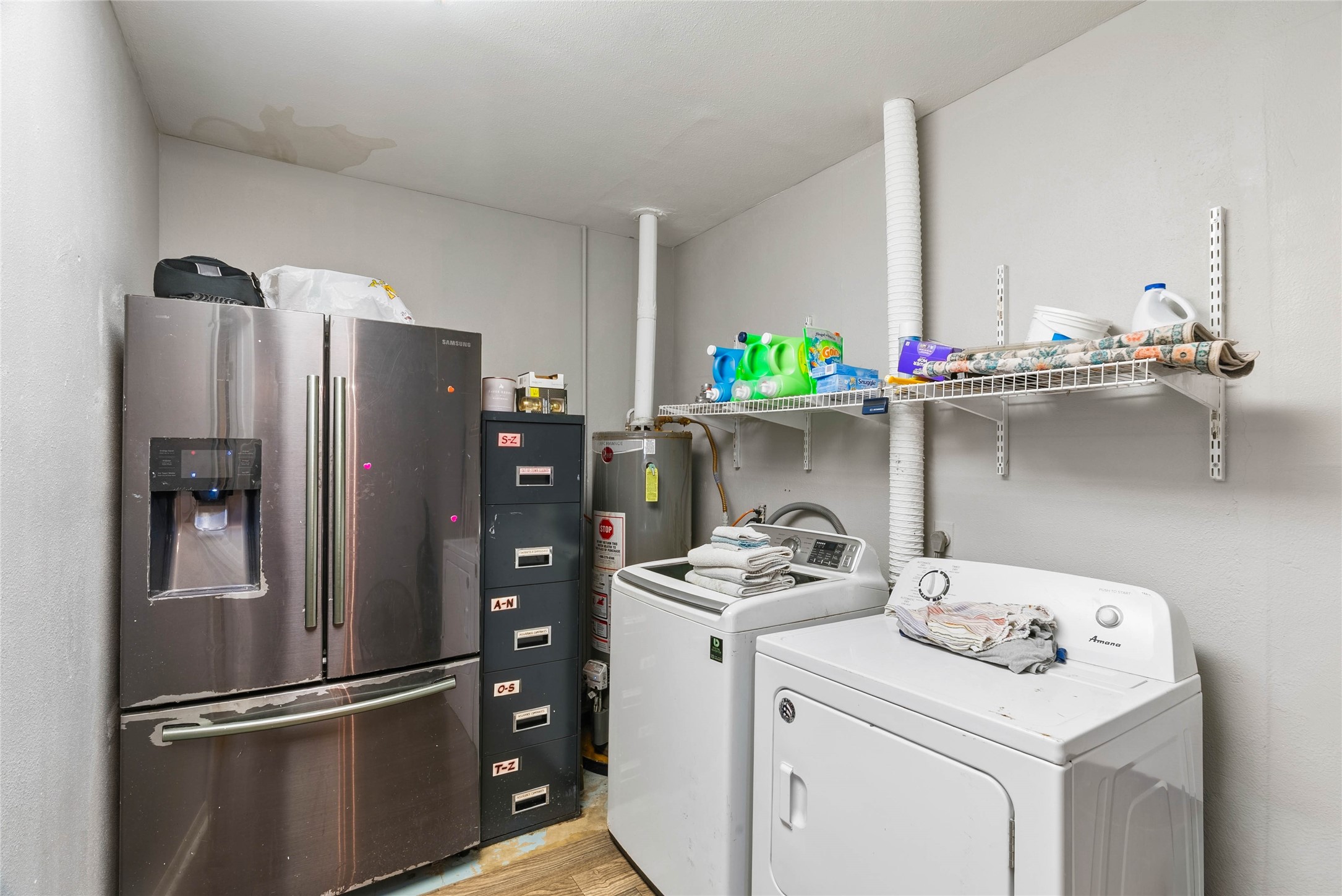168 Sunset Ingleside, TX 78362 - Photo 20 of 26 Dedicated indoor laundry and utility room equipped with washer/dryer hookups and storage shelving.