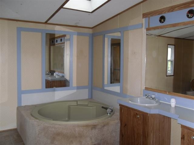 328 Seed Tick Road Sweetwater, TN 37874 - Photo 8 of 12 a bathroom with a tub sink and mirror