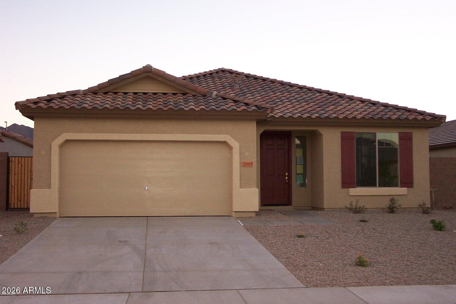 3095 East Merlot Street Gilbert, AZ 85298 - Photo 1 of 13 a front view of a house