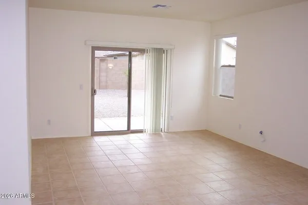 a view of kitchen with sink and refrigerator