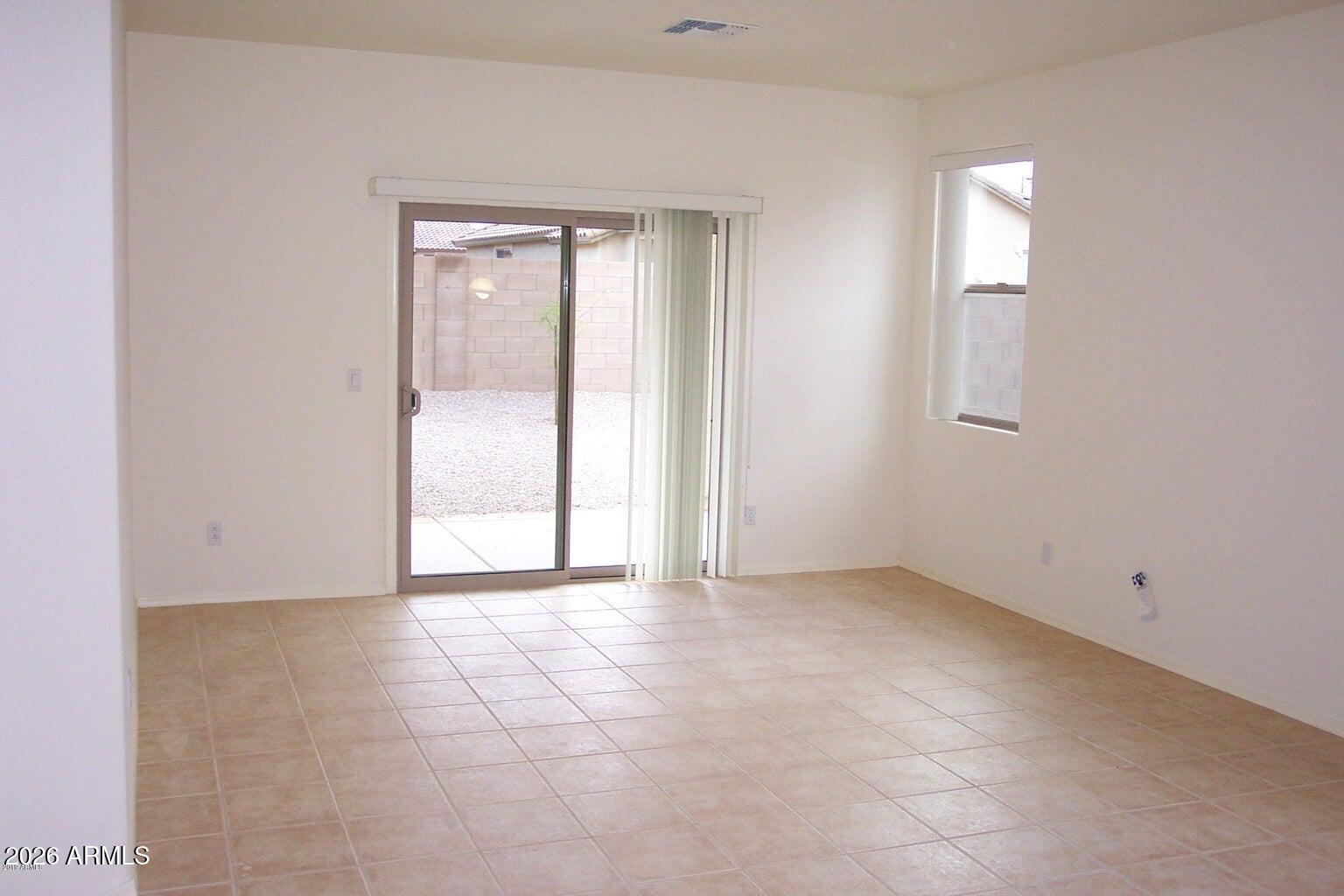 3095 East Merlot Street Gilbert, AZ 85298 - Photo 6 of 13 an empty room with windows and closet