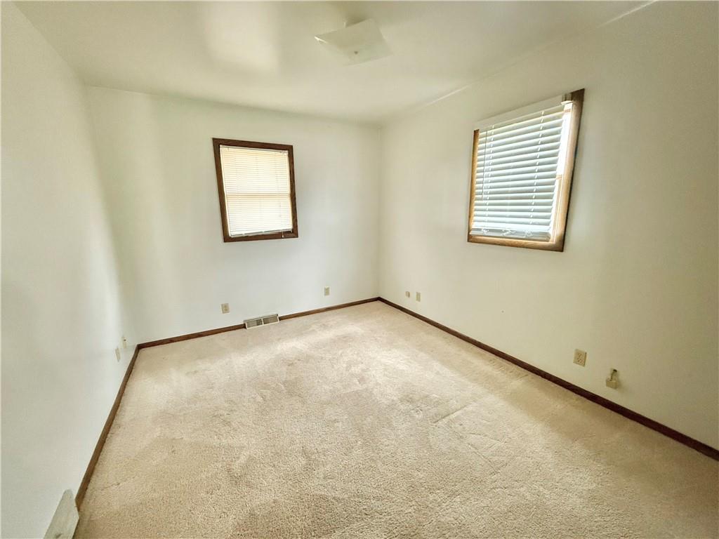 841 East Lutton Street New Castle, PA 16101 - Photo 7 of 12 an empty room with windows