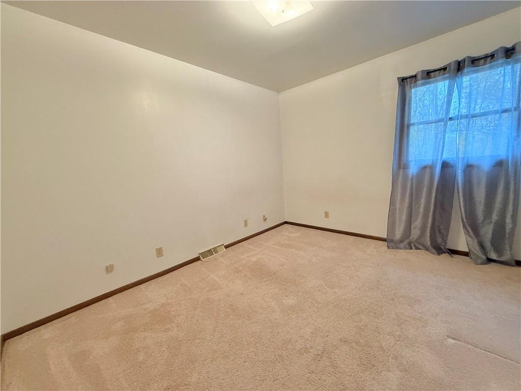 841 East Lutton Street New Castle, PA 16101 - Photo 9 of 12 an empty room with walk in closet with wooden floor