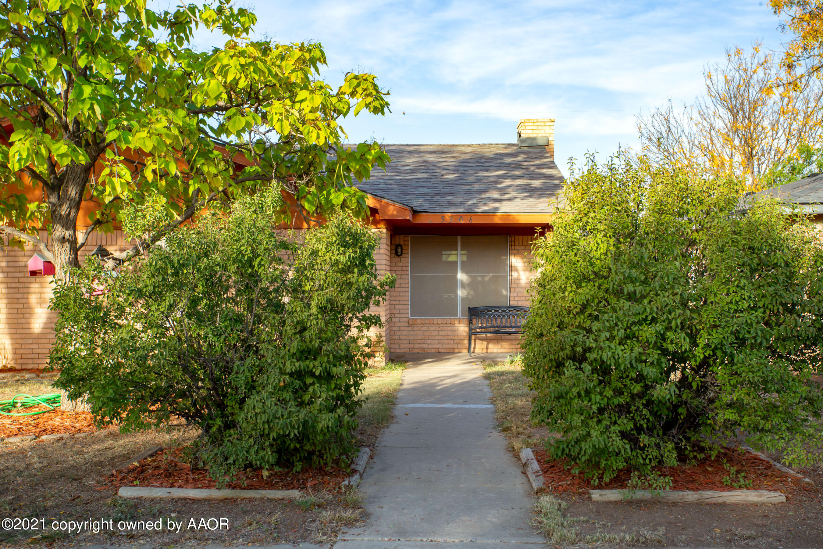 5306 South Fannin Street Amarillo, TX 79110 - Photo 2 of 18 a view of a pathway both side of the house