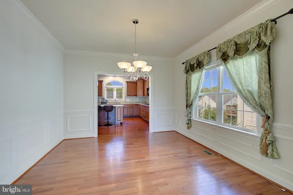a view of an empty room with a flat screen tv