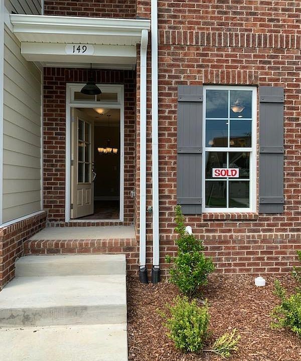 149 Mary Ann Circle Spring Hill, TN 37174 - Photo 2 of 18 a front view of a house with a yard