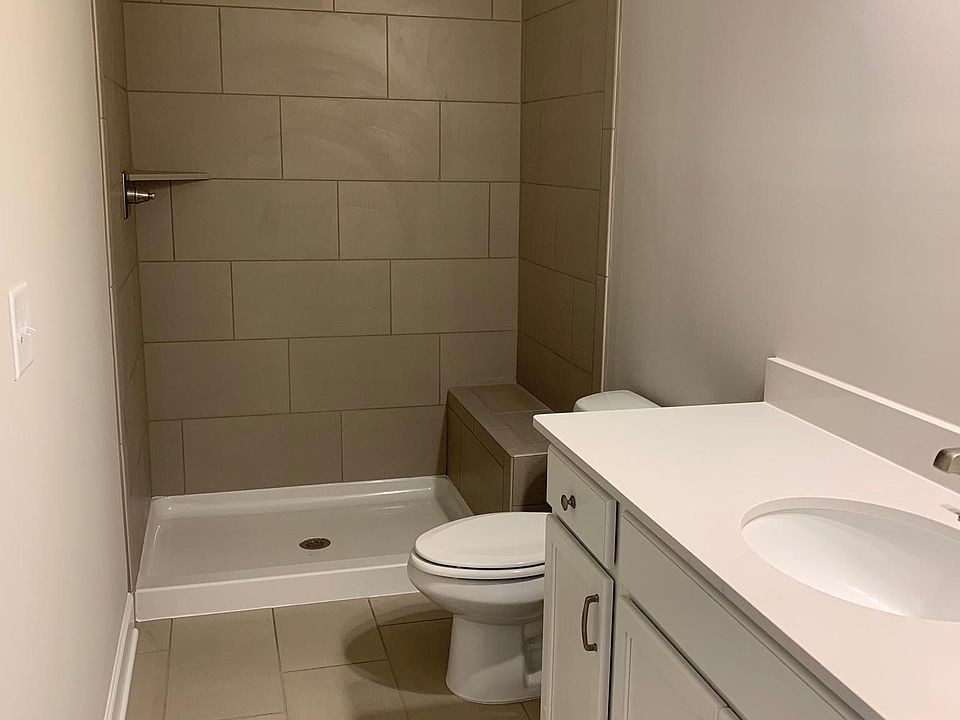 149 Mary Ann Circle Spring Hill, TN 37174 - Photo 7 of 18 a bathroom with a sink a toilet and shower