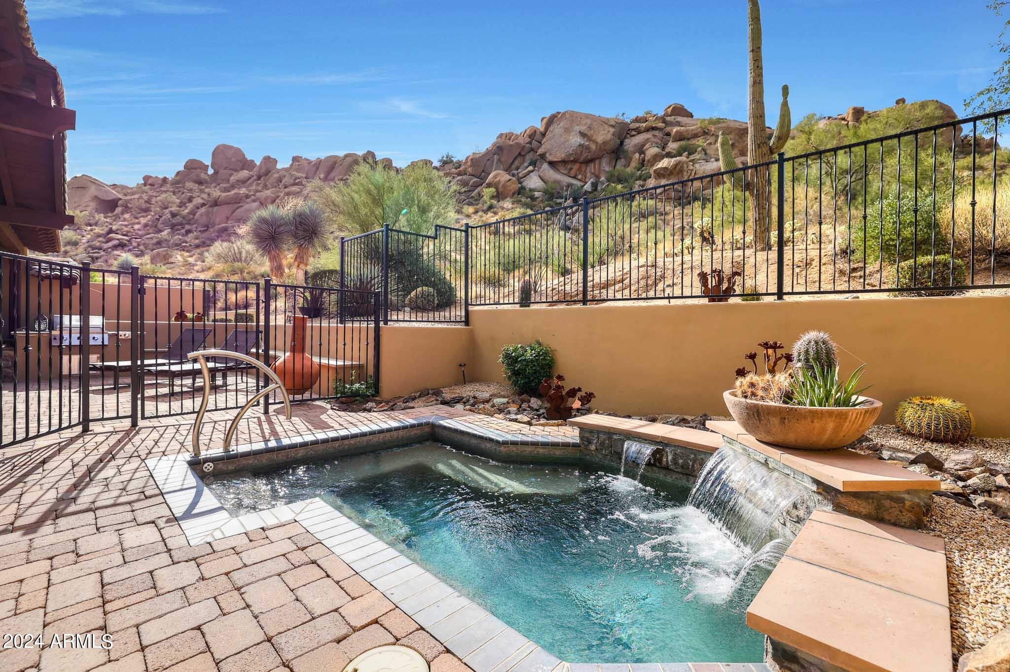 27440 North Alma School Parkway, Unit 363 Scottsdale, AZ 85262 - Photo 2 of 53 a view of a balcony with chairs and wooden floor