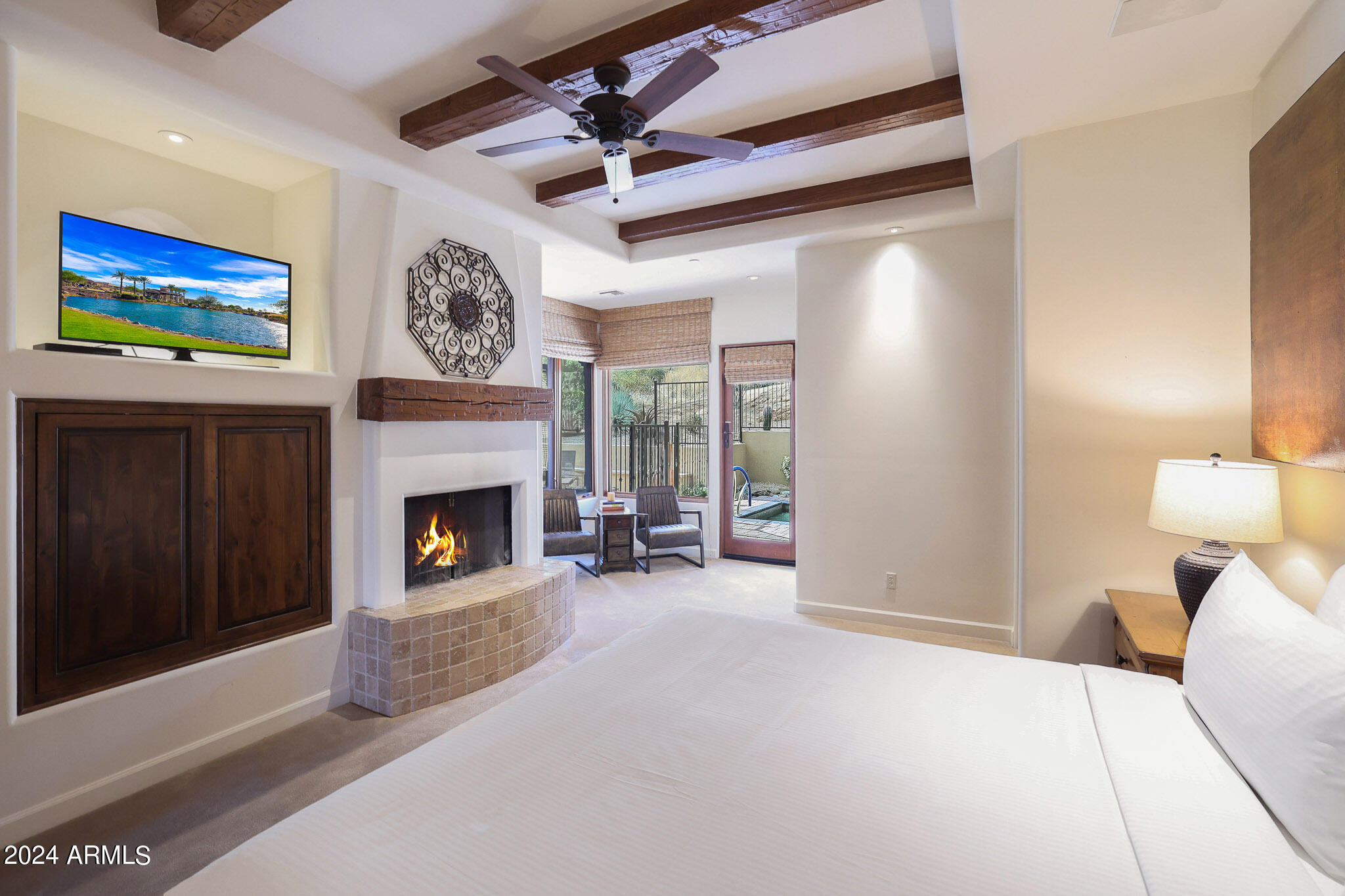 27440 North Alma School Parkway, Unit 363 Scottsdale, AZ 85262 - Photo 27 of 53 a view of a livingroom with a fireplace a ceiling fan and windows