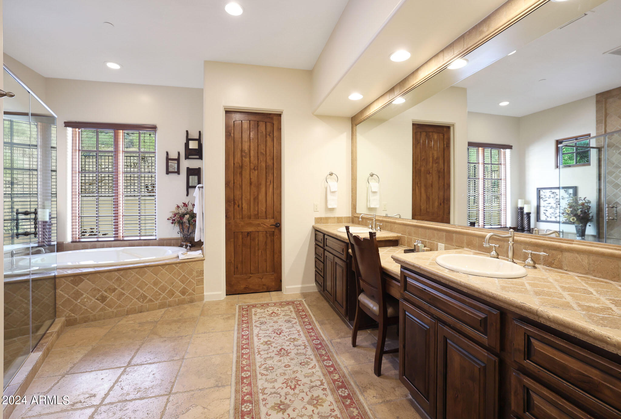 27440 North Alma School Parkway, Unit 363 Scottsdale, AZ 85262 - Photo 28 of 53 a bathroom with a tub a sink and a large mirror