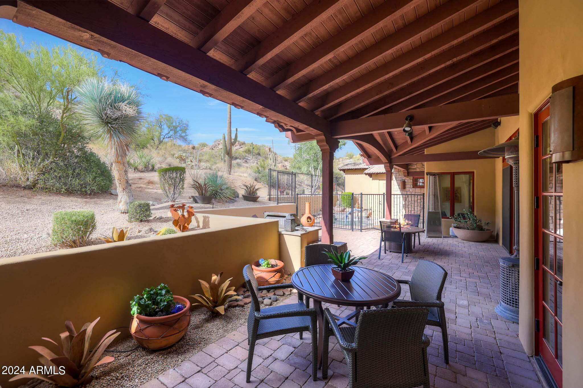 27440 North Alma School Parkway, Unit 363 Scottsdale, AZ 85262 - Photo 38 of 53 a view of a porch with furniture and a potted plant