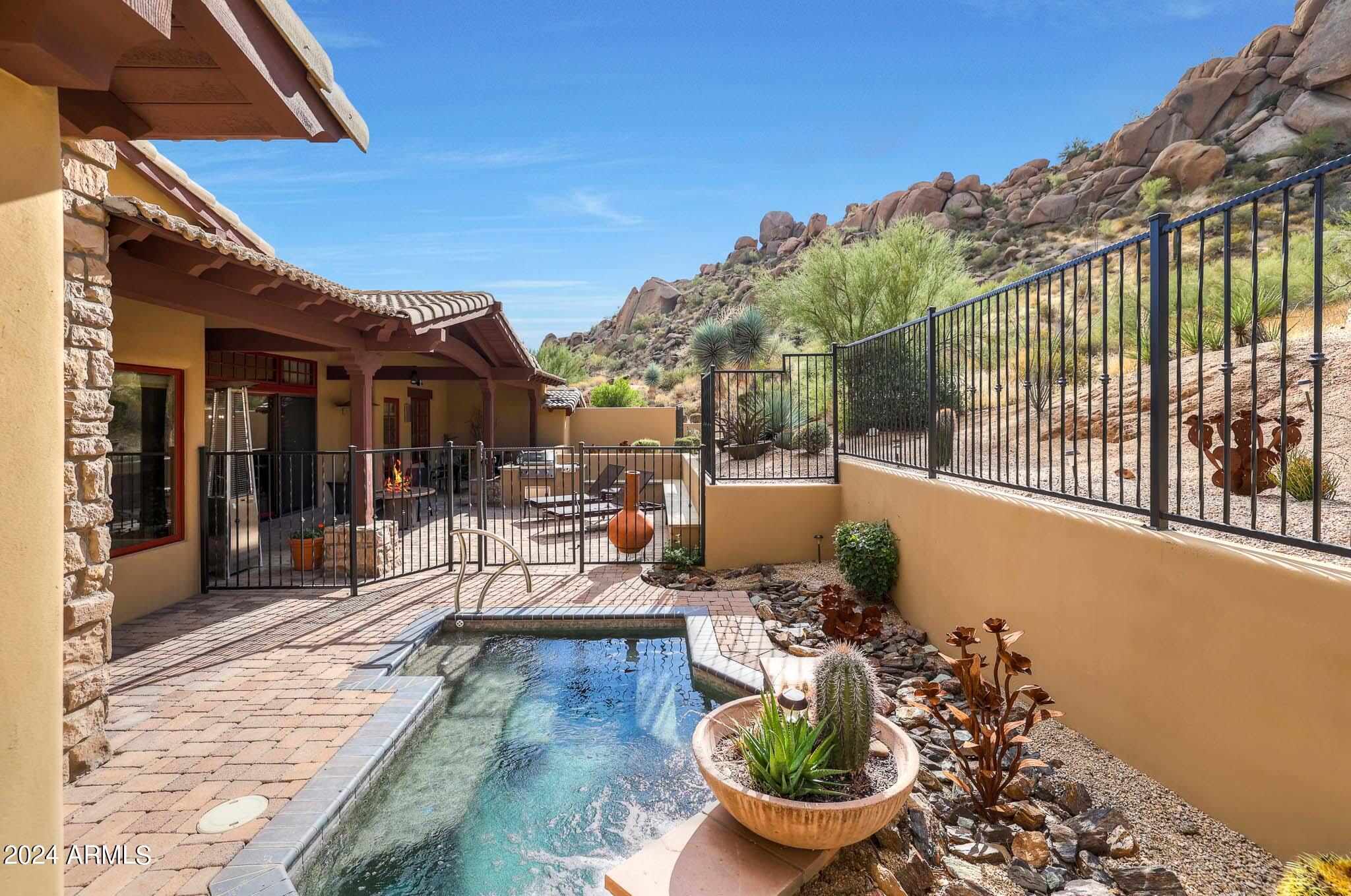 27440 North Alma School Parkway, Unit 363 Scottsdale, AZ 85262 - Photo 39 of 53 a view of a patio with couches table and chairs and potted plants