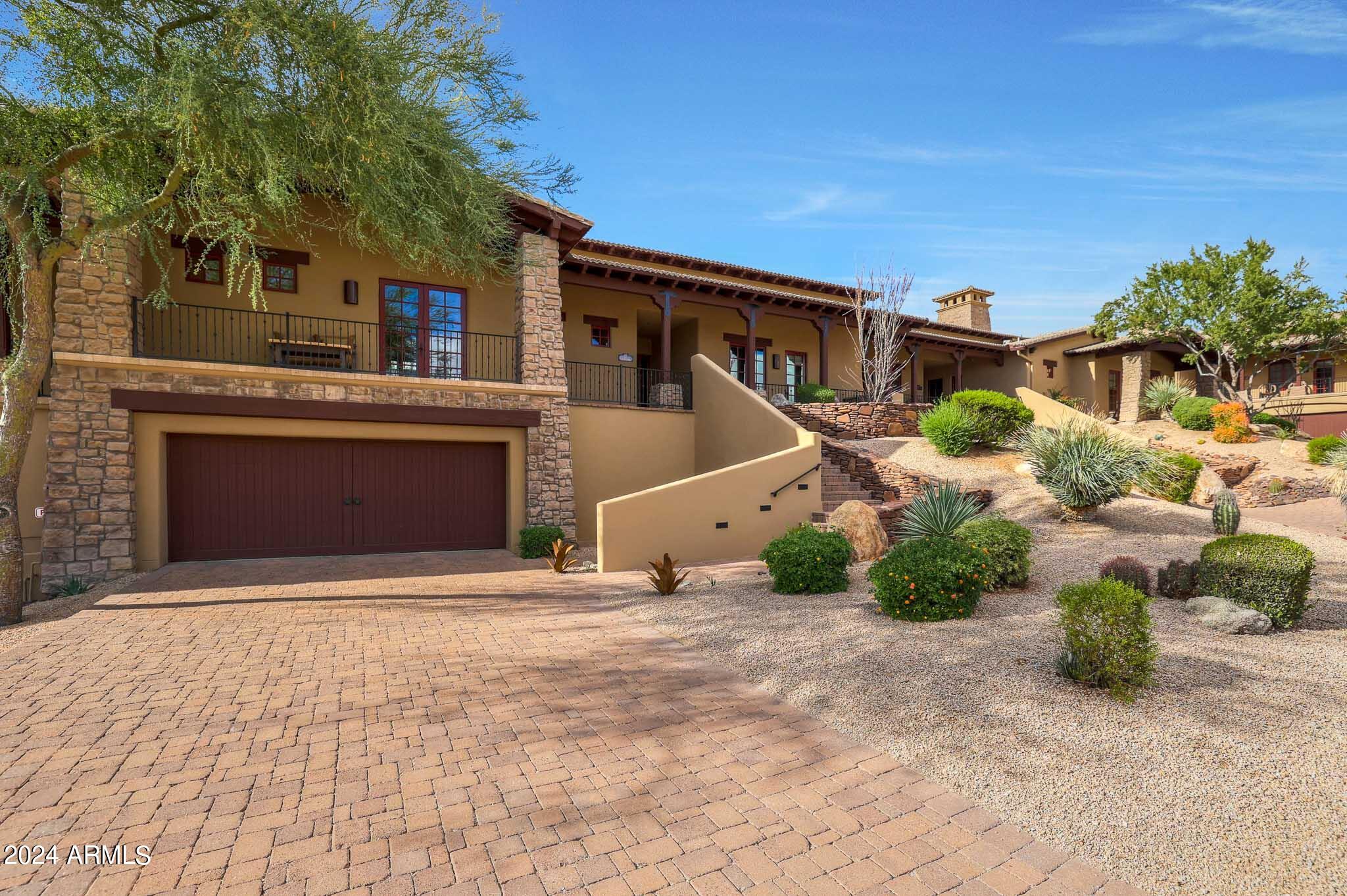 27440 North Alma School Parkway, Unit 363 Scottsdale, AZ 85262 - Photo 53 of 53 a front view of a house with a yard and garage